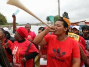 Workers commemorate May Day with a rally against current economic conditions
